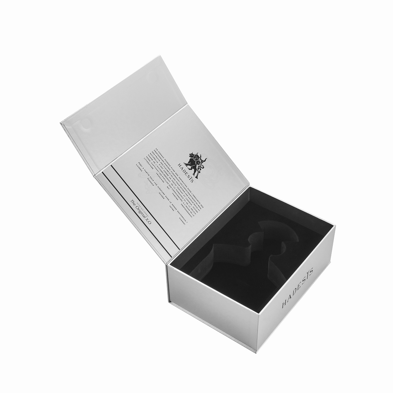 Open white Hadesis XO flip top cognac gift box showing printed lid interior and black EVA foam bottle cradle