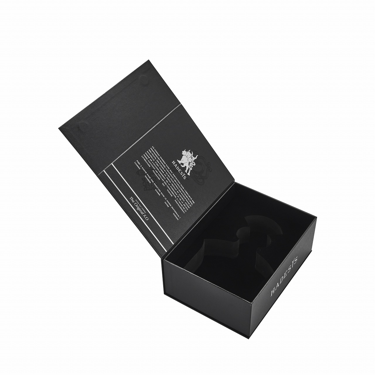 Open black Hadesis XO flip top cognac box showing silver foil interior text and black EVA foam bottle cradle