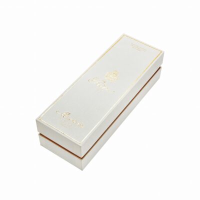 Horizontal closed Ritz Paris Montaña velvet lined wine gift box showing gold foil border frame, gold card edge and linen texture paper