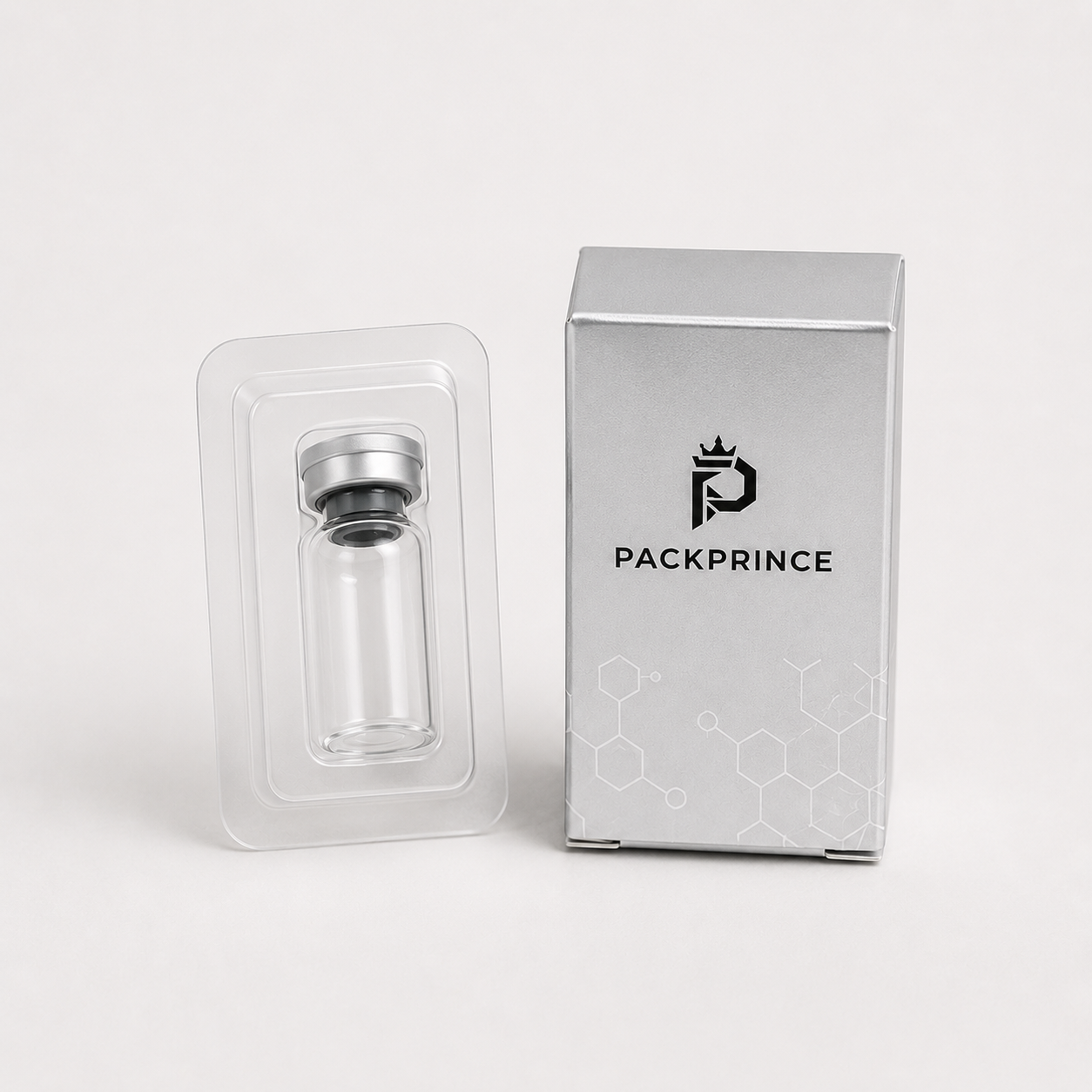 Clear PET blister tray insert fitted around a glass vial for secondary packaging