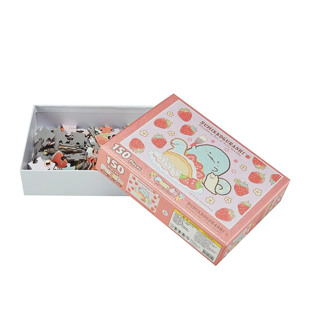 Custom illustrated jigsaw puzzle pieces in opened rigid cardboard box